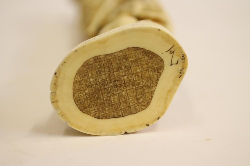A JAPANESE CARVED IVORY ONE PIECE FIGURE Image