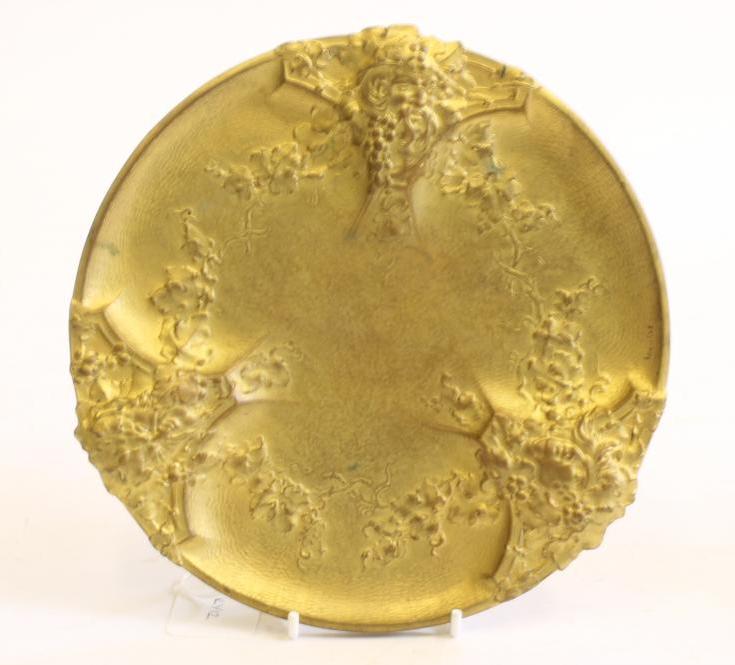 AN ART NOUVEAU GILT METAL DISH of circular form raised upon three bracket feet Image