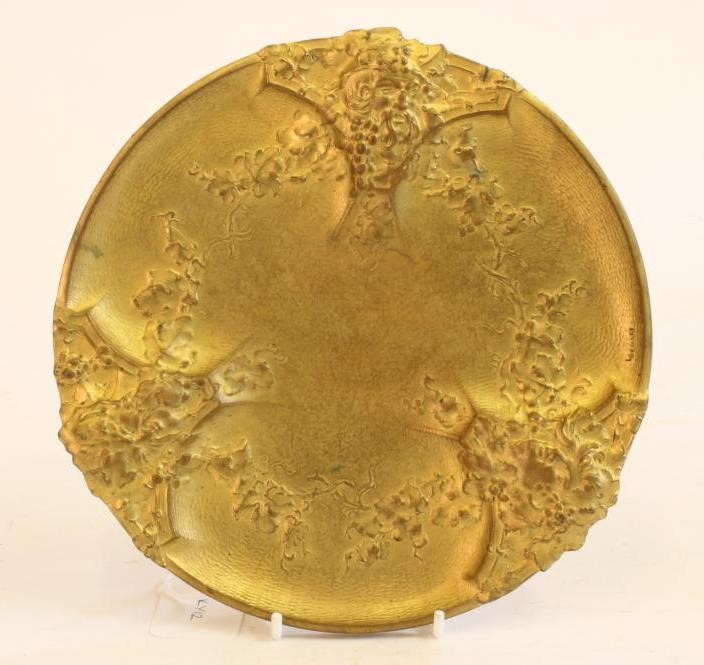 AN ART NOUVEAU GILT METAL DISH of circular form raised upon three bracket feet Image
