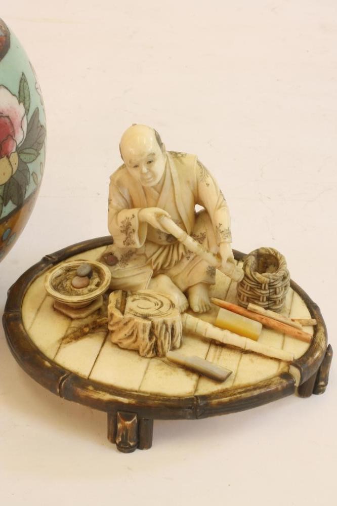 A JAPANESE IVORY FIGURE Image