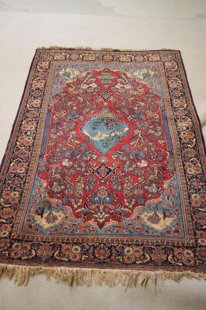 A PERSIAN PICTORIAL RUG Image