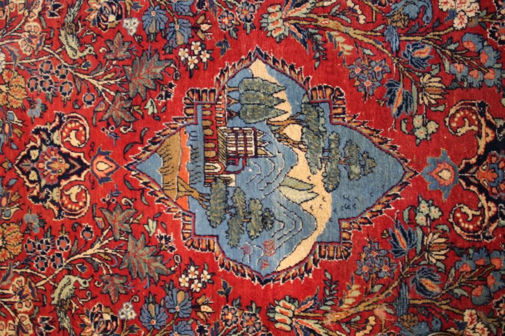 A PERSIAN PICTORIAL RUG Image