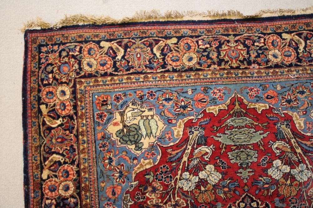 A PERSIAN PICTORIAL RUG Image