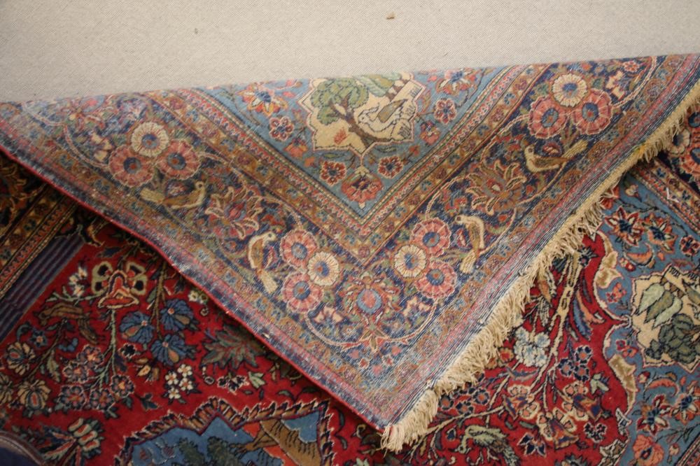 A PERSIAN PICTORIAL RUG Image