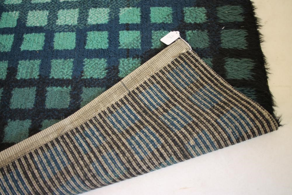 A WOOL HEARTH RUG Image