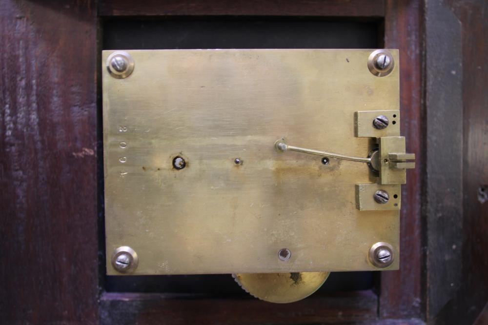 A MAHOGANY WALL CLOCK Image