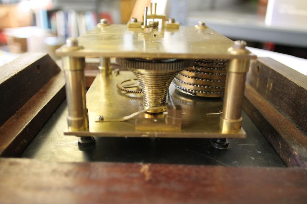 A MAHOGANY WALL CLOCK Image