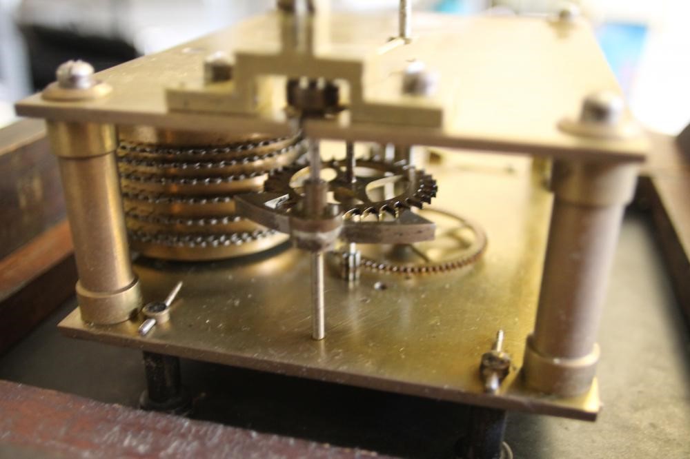 A MAHOGANY WALL CLOCK Image