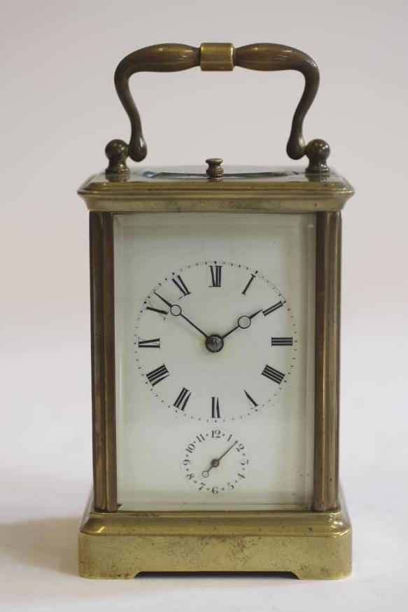A BRASS CASED REPEATER CARRIAGE CLOCK Image