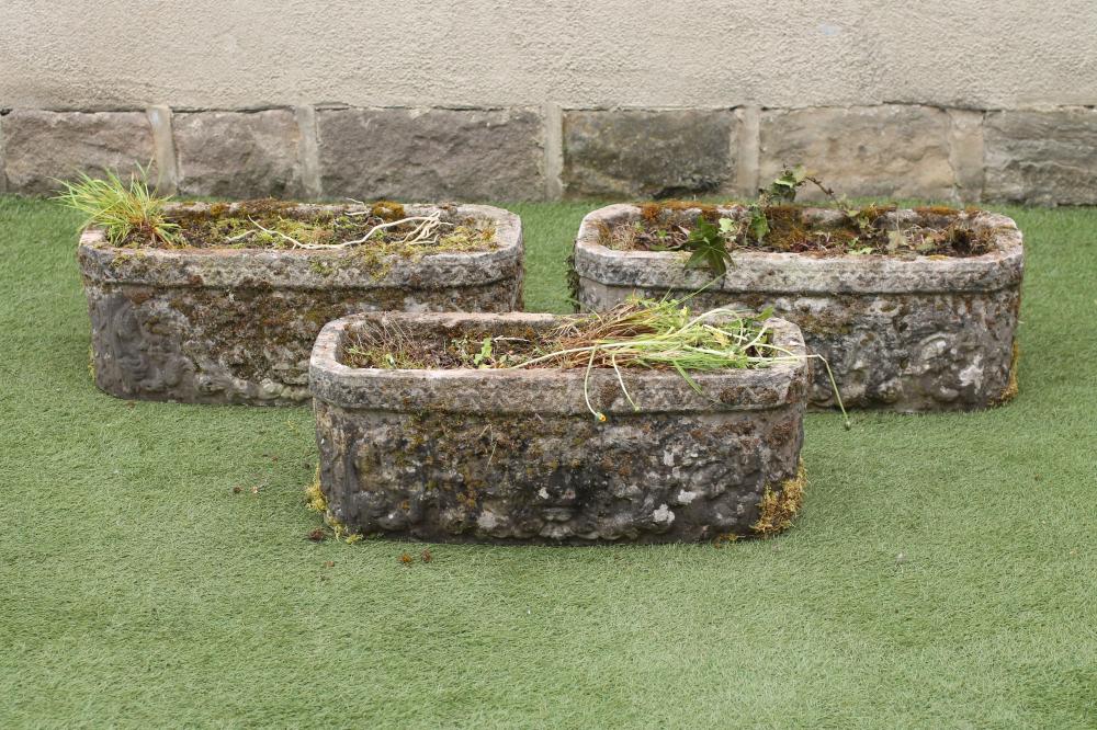 A SET OF THREE COMPOSITION STONE PLANTERS to match the previous lot Image