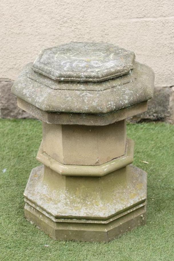 A SANDSTONE PLINTH of hexagonal form with moulded top and base and central waist banding Image
