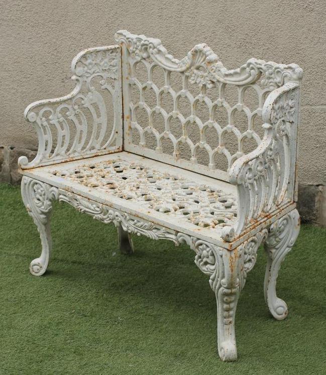 A CAST IRON GARDEN BENCH Image