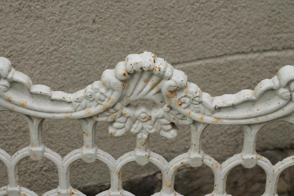 A CAST IRON GARDEN BENCH Image