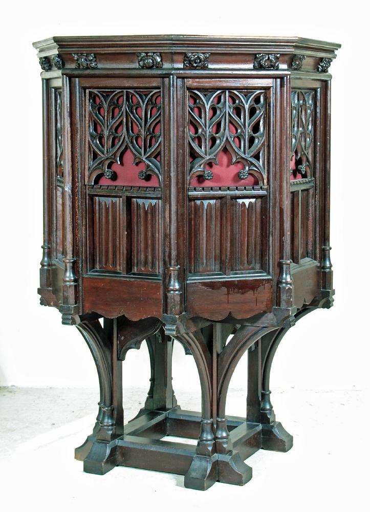 A VICTORIAN STAINED PINE PULPIT of hexagonal form with hinged doors Image