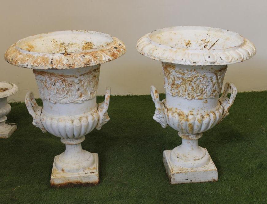 A PAIR OF CAST IRON URNS Image