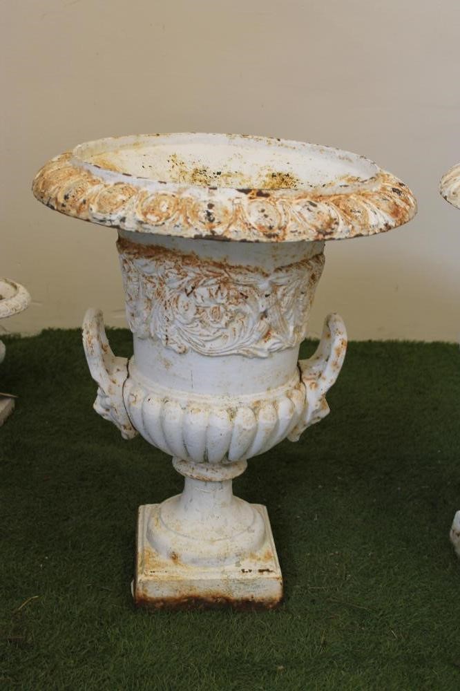 A PAIR OF CAST IRON URNS Image