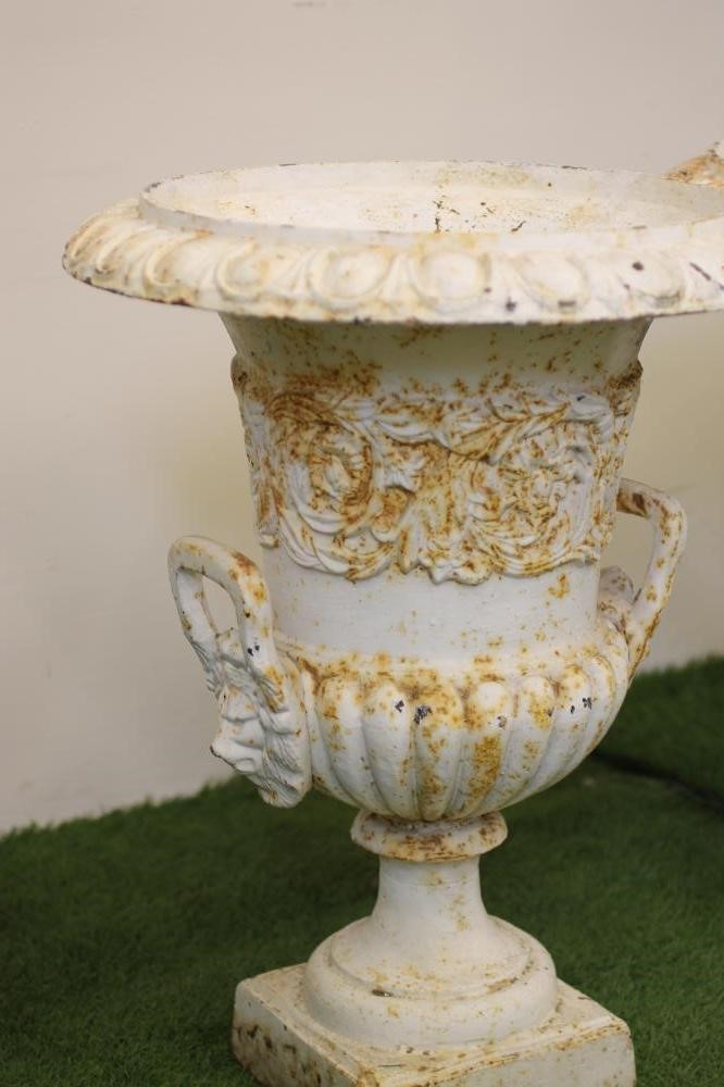 A PAIR OF CAST IRON URNS Image
