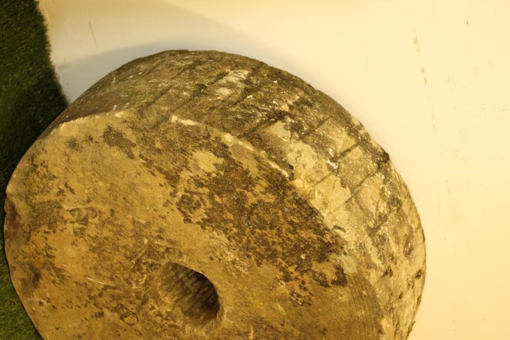 A SANDSTONE MILL STONE Image