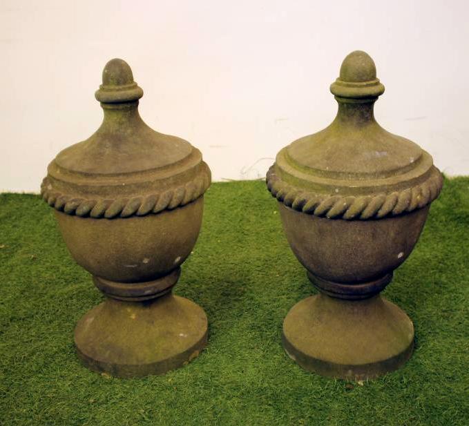A PAIR OF VICTORIAN SANDSTONE FINIALS of lidded urn form with turned finials and rope twist banding Image