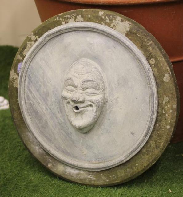 A LEAD FOUNTAIN HEAD of circular form modelled as a grotesque mask Image