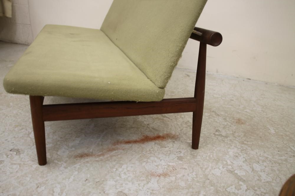 A DANISH TEAK FRAMED THREE SEATER SOFA upholstered in a pale green weave Image