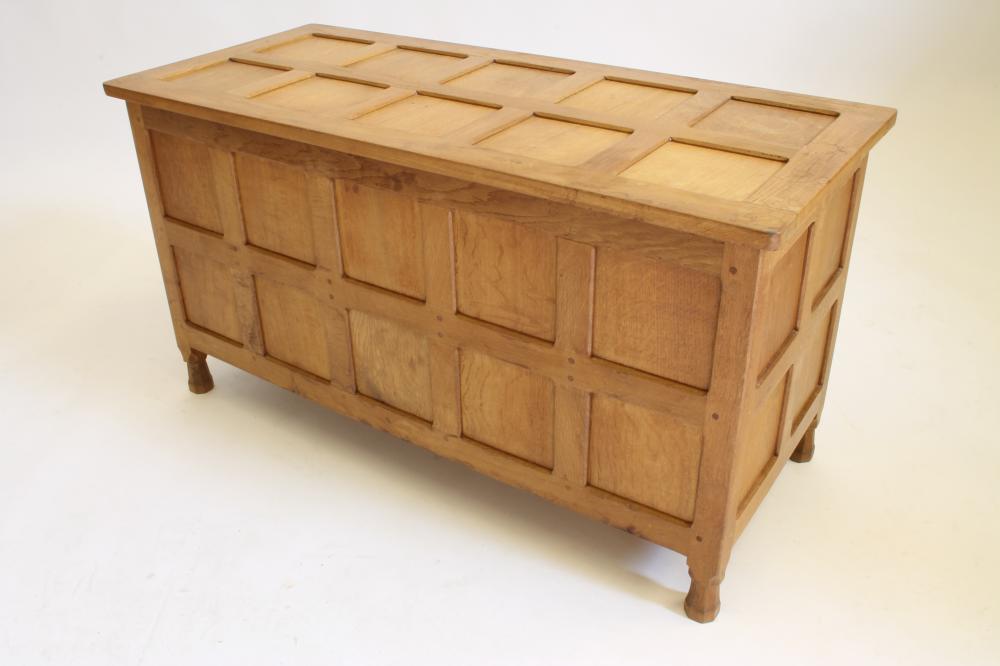 AN OAK PANELLED COFFER in the manner of Robert Thompson "Mouseman" Image