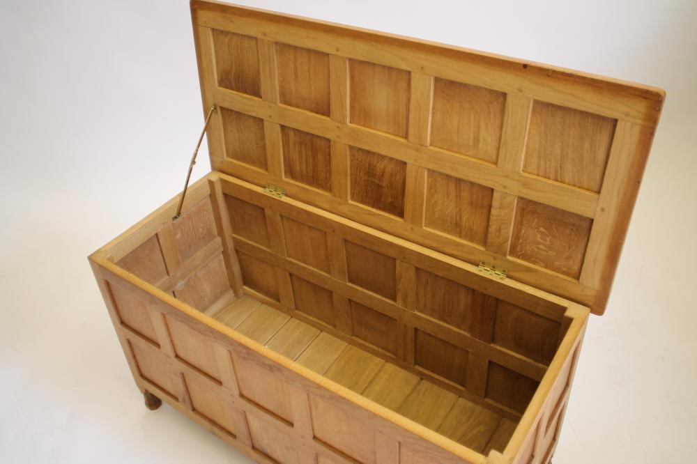 AN OAK PANELLED COFFER in the manner of Robert Thompson "Mouseman" Image