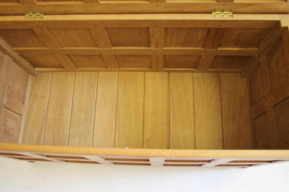 AN OAK PANELLED COFFER in the manner of Robert Thompson "Mouseman" Image