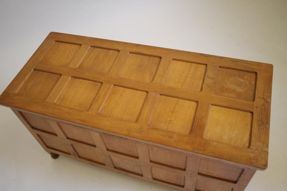 AN OAK PANELLED COFFER in the manner of Robert Thompson "Mouseman" Image