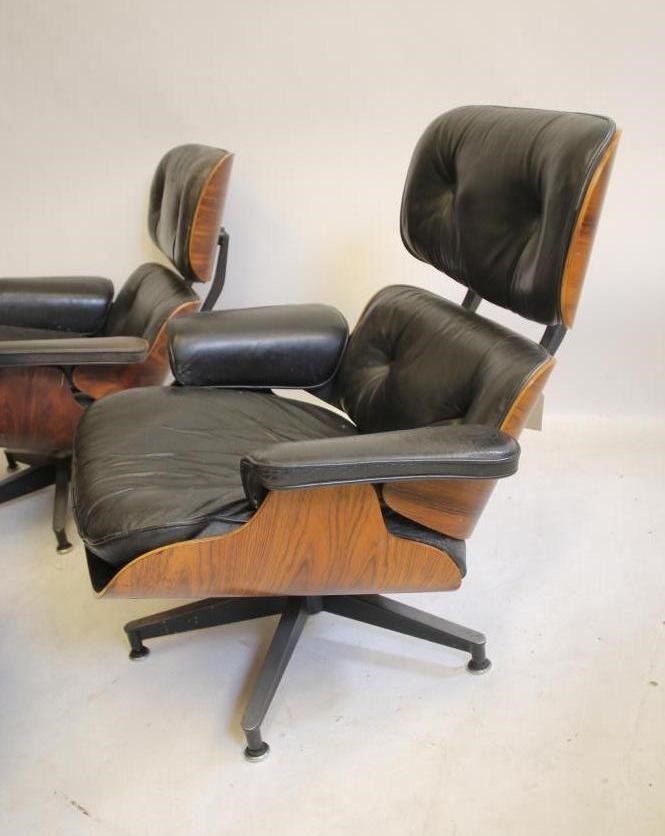 A MATCHED PAIR OF SWIVEL LOUNGE CHAIRS by Charles & Ray Eames for Herman Miller Image
