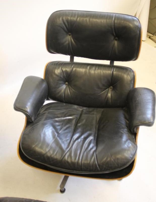 A MATCHED PAIR OF SWIVEL LOUNGE CHAIRS by Charles & Ray Eames for Herman Miller Image