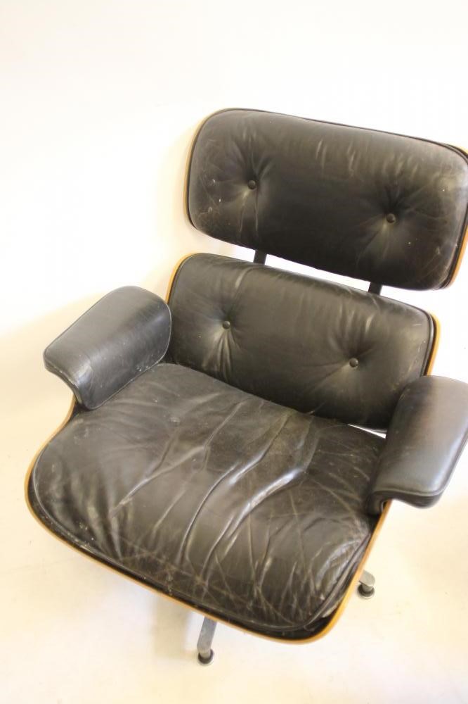 A MATCHED PAIR OF SWIVEL LOUNGE CHAIRS by Charles & Ray Eames for Herman Miller Image