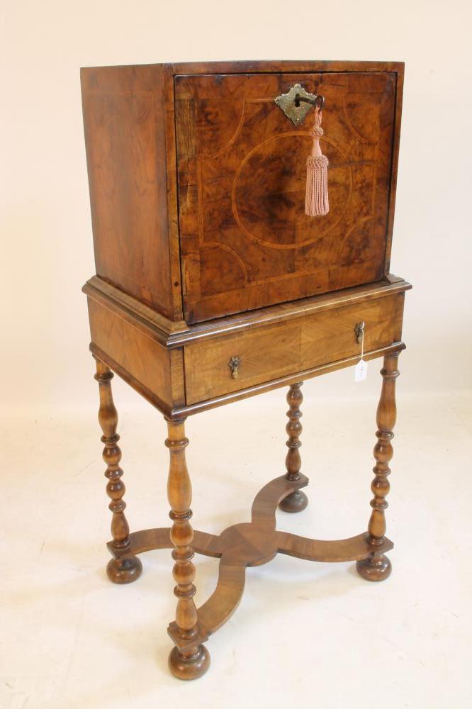 A WILLIAM & MARY WALNUT AND FEATHER BANDED CABINET on later stand Image