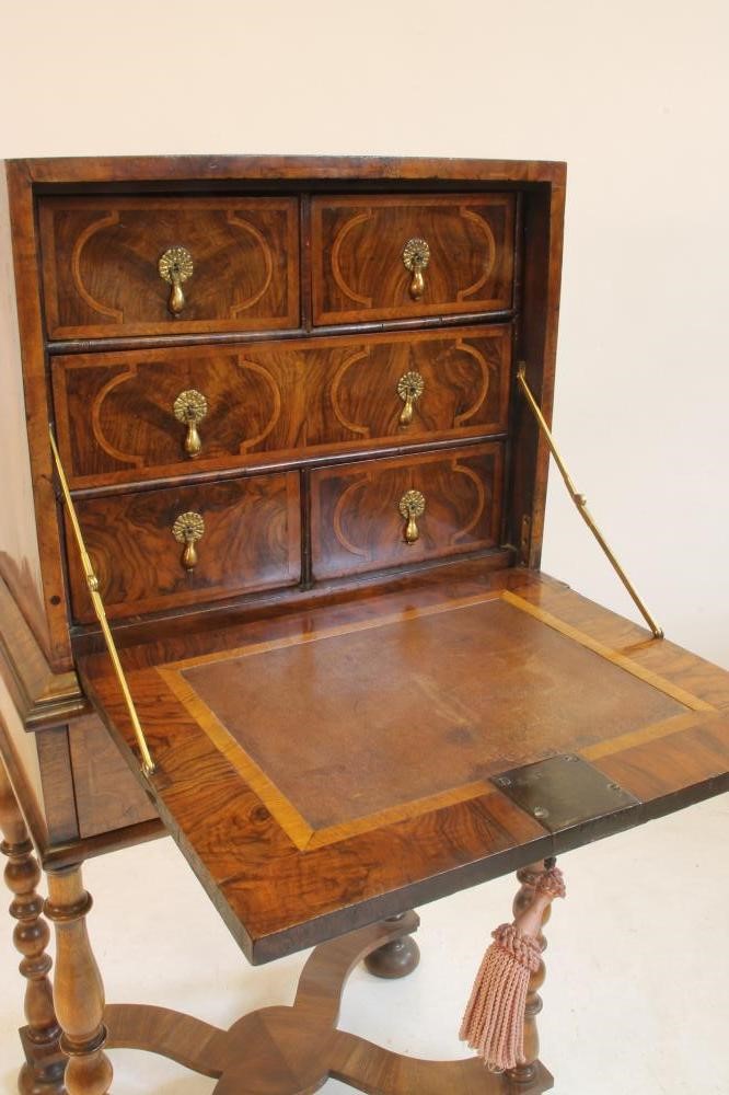 A WILLIAM & MARY WALNUT AND FEATHER BANDED CABINET on later stand Image