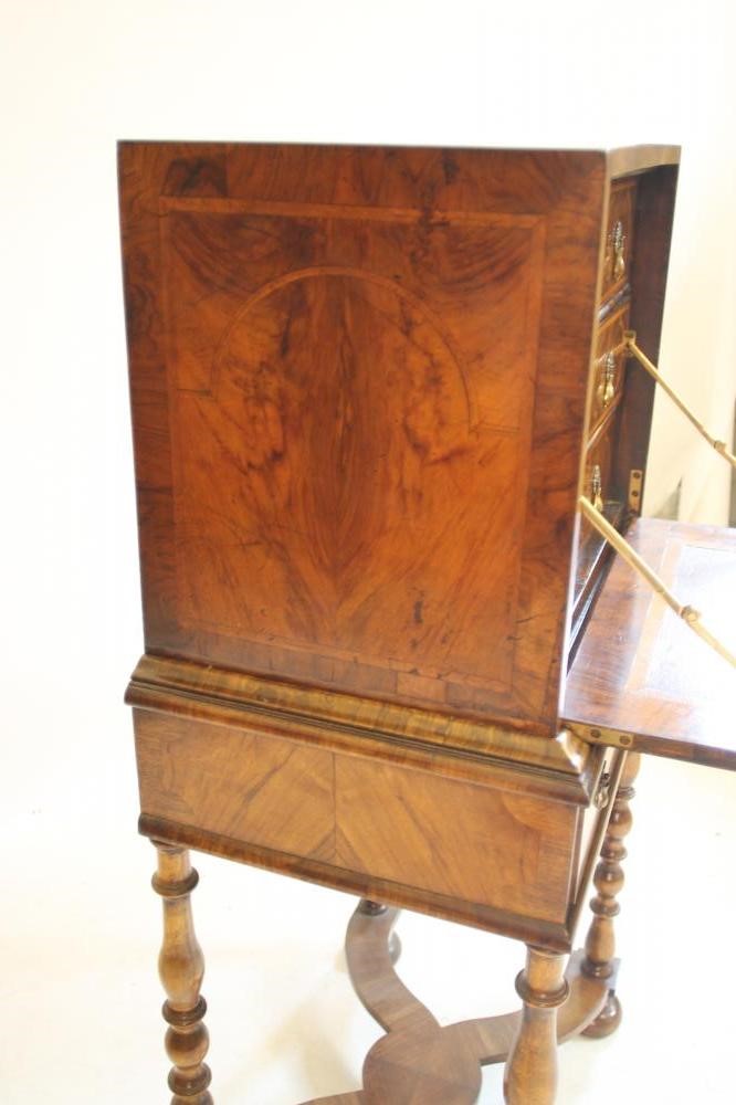 A WILLIAM & MARY WALNUT AND FEATHER BANDED CABINET on later stand Image
