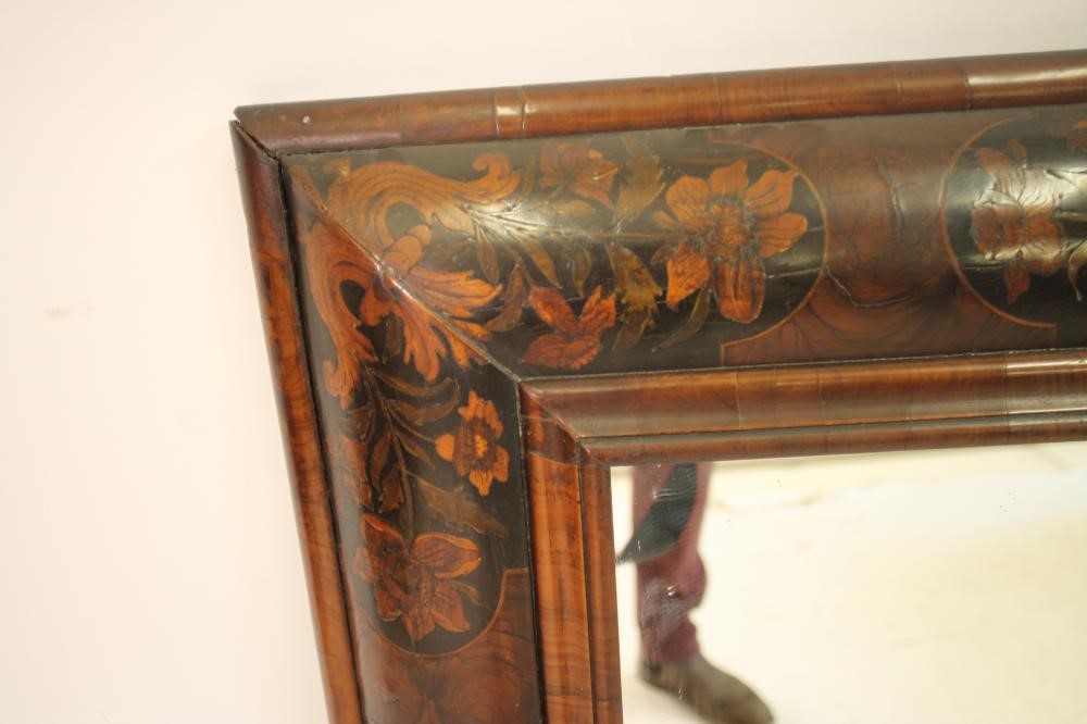 A WILLIAM & MARY LABURNUM OYSTER VENEERED AND FLORAL MARQUETRY CUSHION FRAMED WALL MIRROR Image