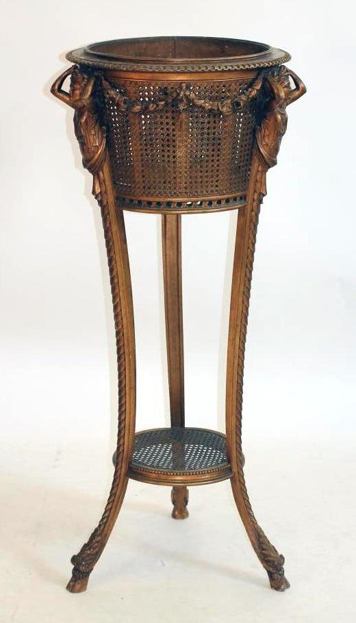 A CARVED GILT WOOD AND CANED JARDINIERE STAND Image