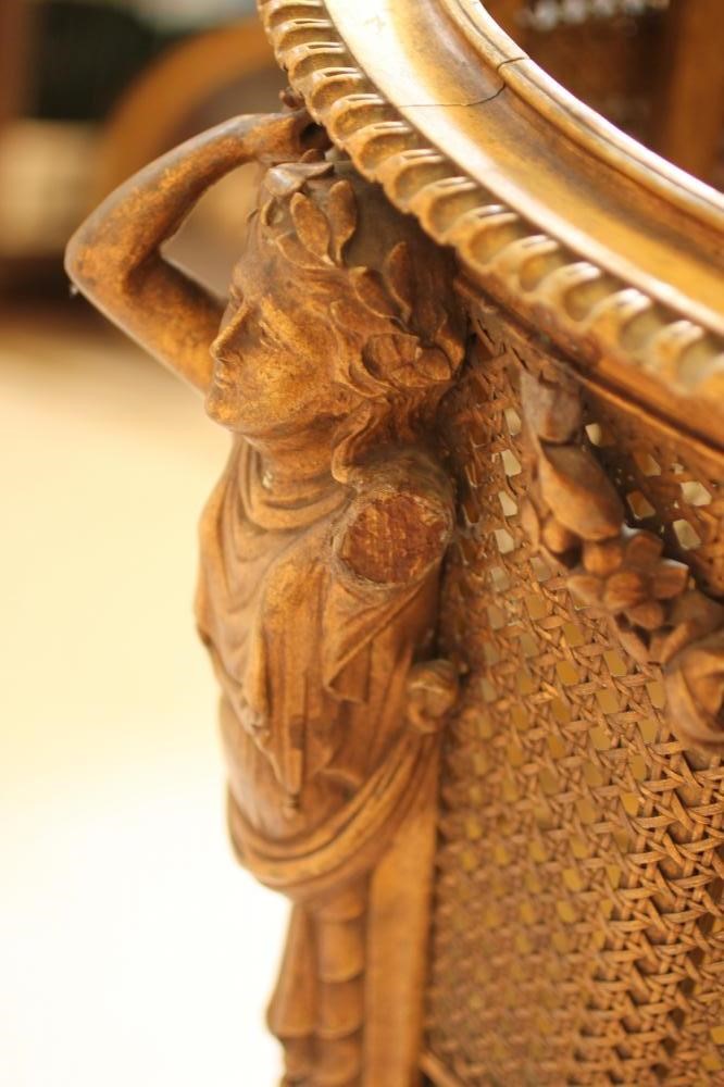 A CARVED GILT WOOD AND CANED JARDINIERE STAND Image