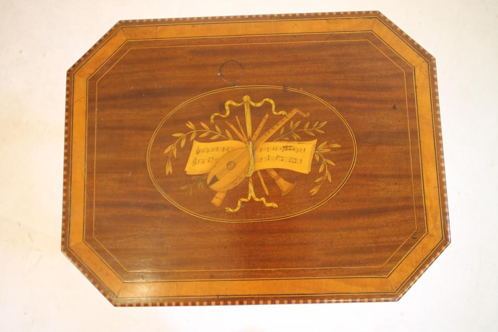 AN EDWARDIAN MAHOGANY AND SATINWOOD BANDED OCCASIONAL TABLE of canted oblong form Image