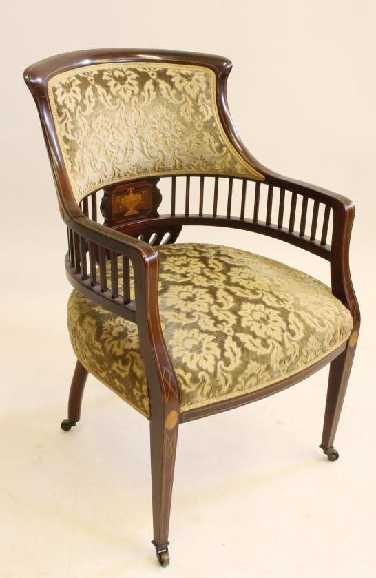 A LADY'S EDWARDIAN ELBOW CHAIR of tub form with stringing and marquetry Image