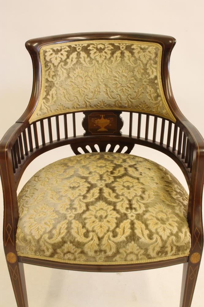 A LADY'S EDWARDIAN ELBOW CHAIR of tub form with stringing and marquetry Image