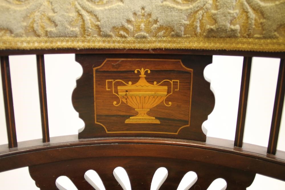 A LADY'S EDWARDIAN ELBOW CHAIR of tub form with stringing and marquetry Image