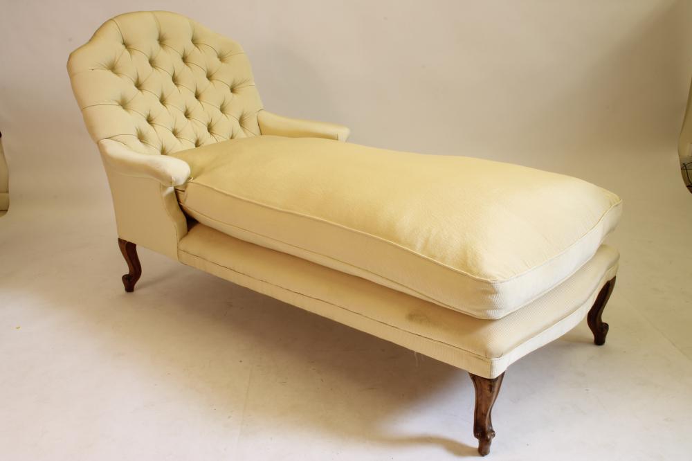 A VICTORIAN WALNUT FRAMED DAY BED button upholstered in a cream ribbed weave Image