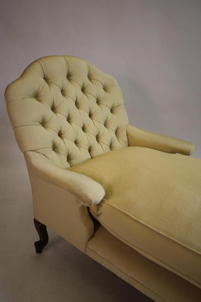 A VICTORIAN WALNUT FRAMED DAY BED button upholstered in a cream ribbed weave Image