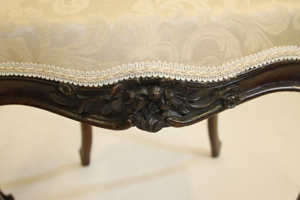 A PAIR OF VICTORIAN CARVED ROSEWOOD SIDE CHAIRS upholstered in champagne damask Image