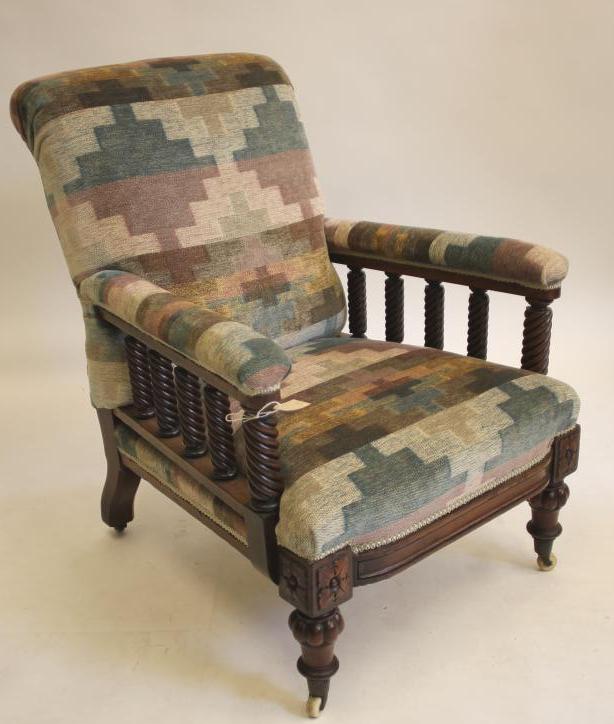 A VICTORIAN WALNUT FRAMED ARMCHAIR upholstered in a chequered weave Image