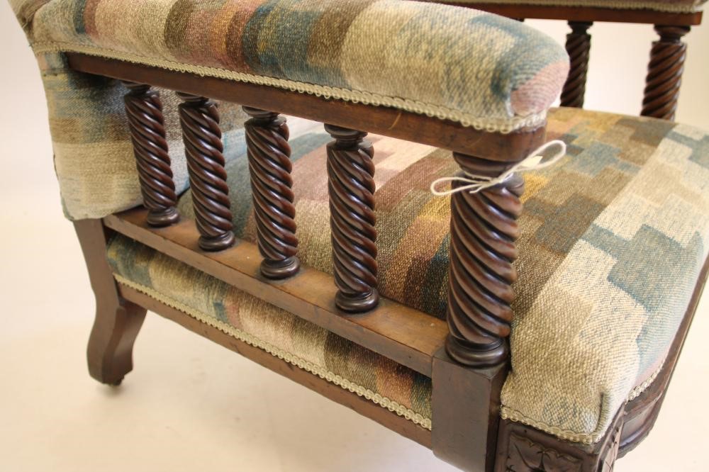 A VICTORIAN WALNUT FRAMED ARMCHAIR upholstered in a chequered weave Image