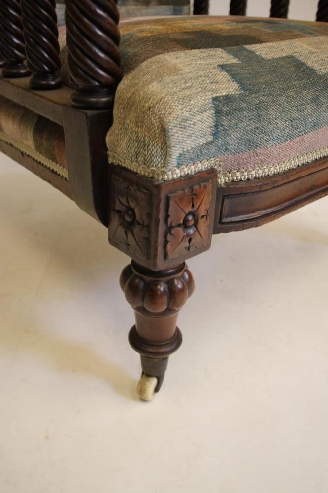 A VICTORIAN WALNUT FRAMED ARMCHAIR upholstered in a chequered weave Image