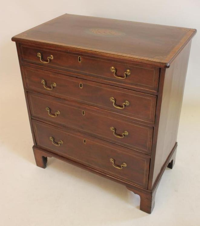 A SMALL MAHOGANY CHEST Image