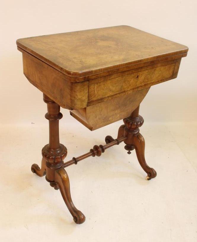 A VICTORIAN BURR WALNUT SEWING/CARD TABLE of rounded oblong form with inlaid floral sprays and Image